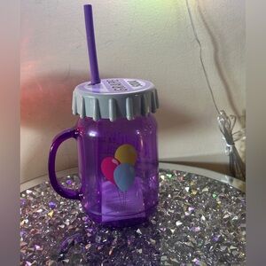 Disney Grape Soda cup with straw.